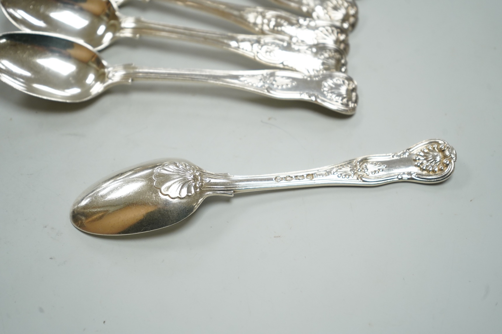 A matched set of ten William IV/Victorian silver Kings pattern teaspoons, including nine by Mary Chawner, London, 1834 and 1837, 11.5oz.